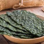 Crispy dried seaweed on wooden plate